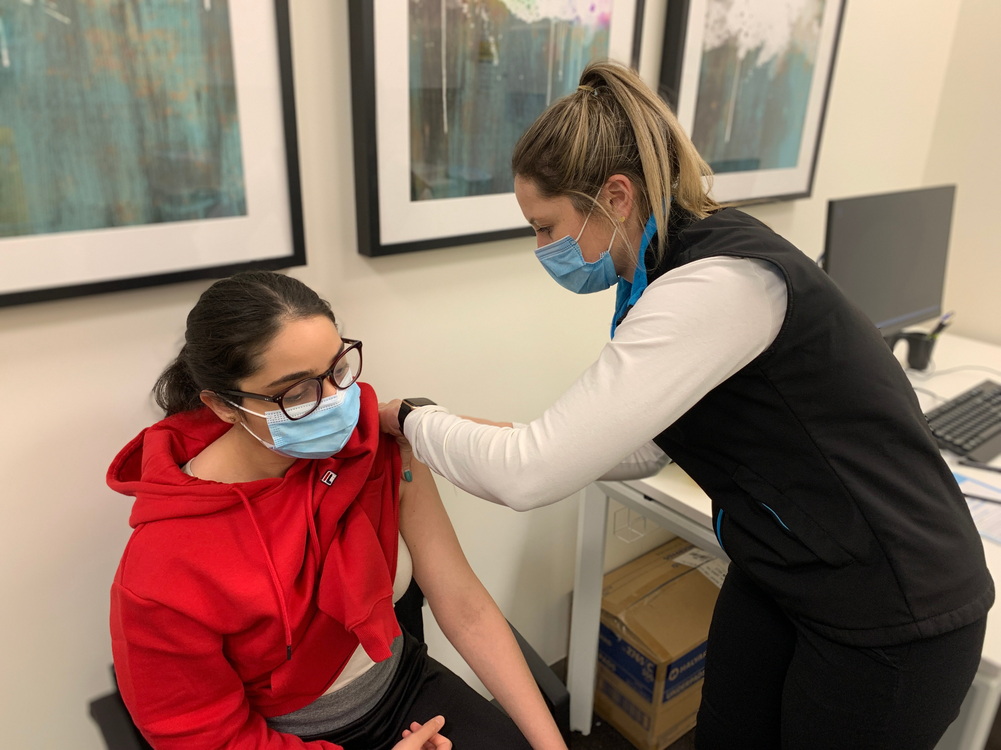 Aged care worker being vaccinated