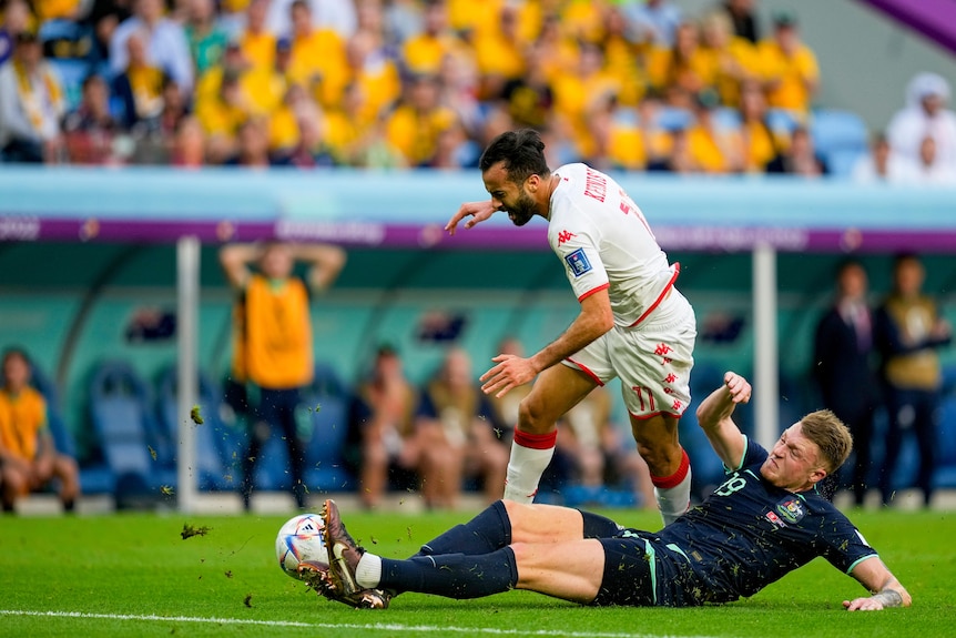 Souttar makes a sliding tackle.