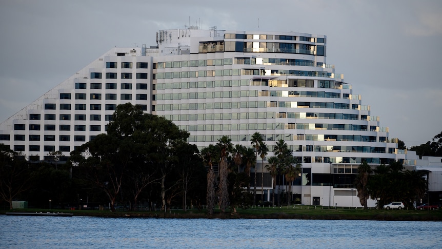 A wide shot of Crown Casino Perth with the Swan River in the foreground.