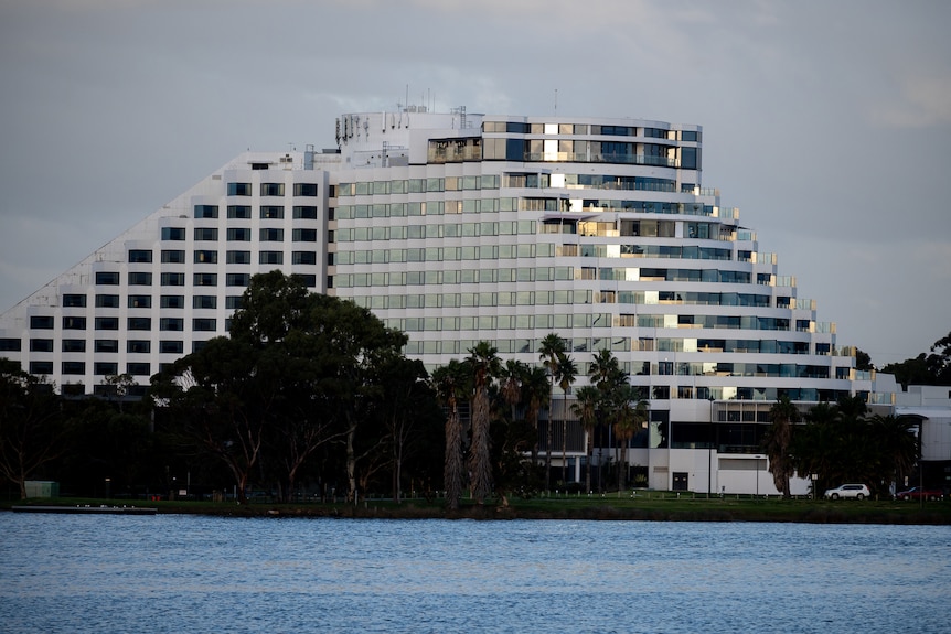 A wide shot of Crown Casino Perth with the Swan River in the foreground.