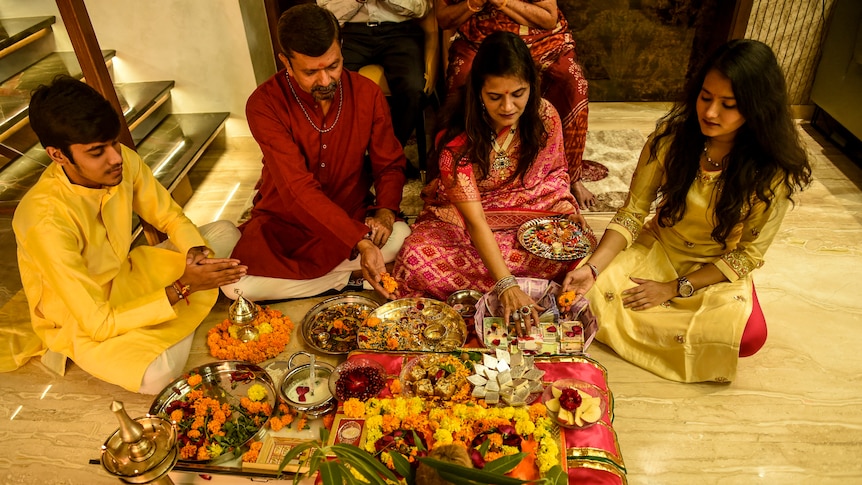 A family gathers to celebrate Diwali.