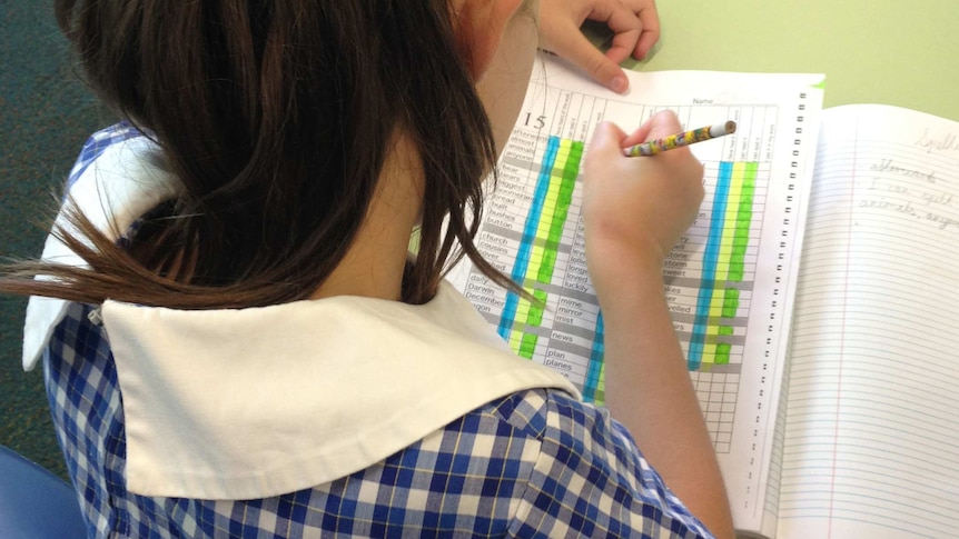 Female student working on a spelling list