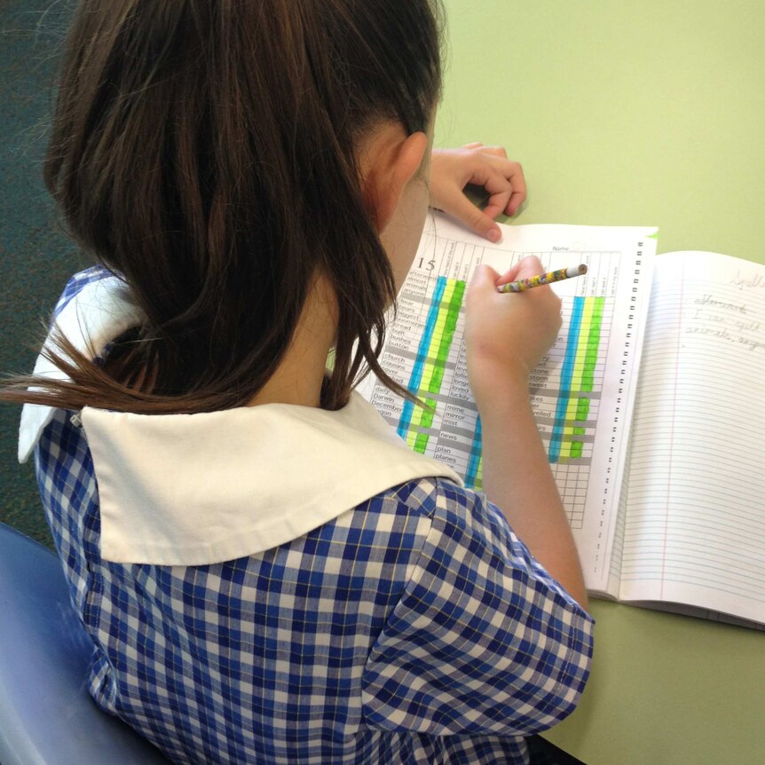 Female student working on a spelling list