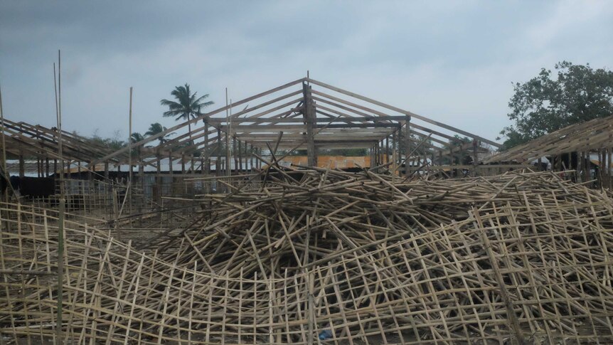 Building materials for new longhouses waiting for stalled construction to get underway at the Baw Du Pha 2 refugee camp.