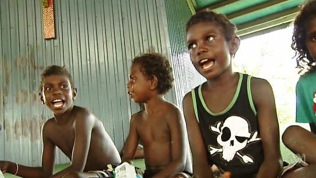 Three Indigenous boys sing