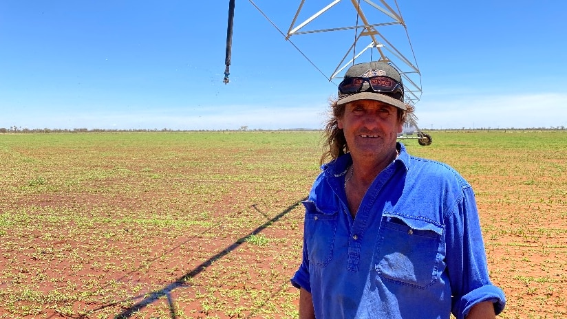 Man standing near a centre pivot