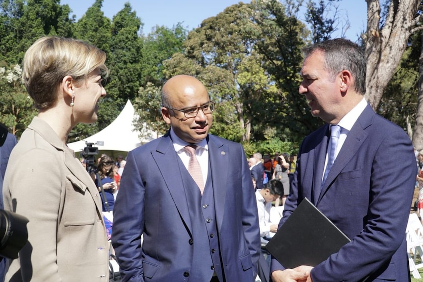 GFG Alliance chair Sanjeev Gupta (middle) and SA Premier Steven Marshall stand together at an announcement.