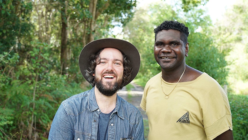 Singer-songwriters Jordie Lane and Yirrmal standing in the Australian bush