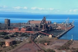 A photograph of the Whyalla steelworks where they meet the sea.