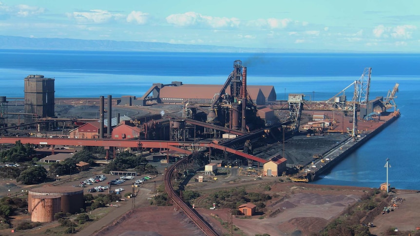 A photograph of the Whyalla steelworks where they meet the sea.