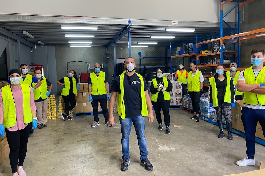 Director Danny Mikati (centre) with his team at AusRelief during coronavirus.