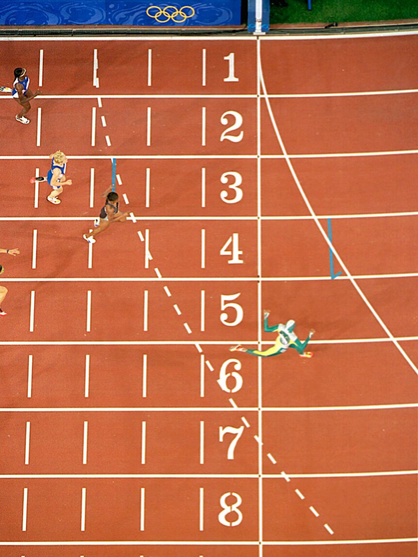 Cathy Freeman crosses line in 400m final at Sydney Olympics.