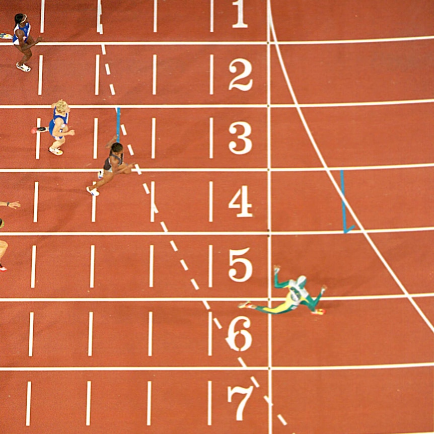 Cathy Freeman crosses line in 400m final at Sydney Olympics.