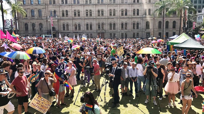 Thousands of people rally in Brisbane's CBD at Queens Gardens for same-sex marriage.