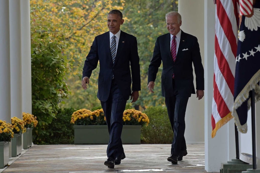 President Barack Obama and Vice President Joe Biden walk from the Oval Office to the Rose Garden at the White House in Washington, Wednesday, Nov 9, 2016.