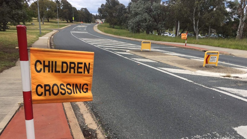 Sign that reads 'Children Crossing' outside a Canberra school.