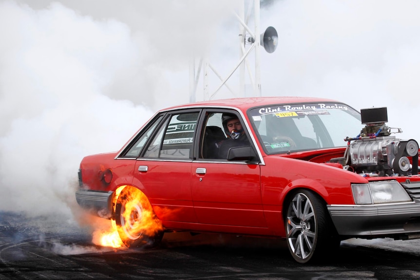 A car catches fire while performing a burnout at the Summernats.