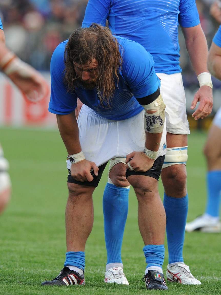 Italian rugby player with hands on knees at World Cup