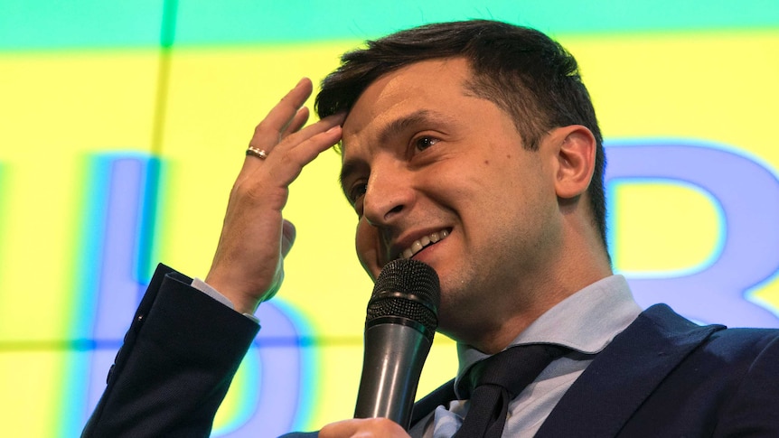 Ukrainian comedian Volodymyr Zelenskiy, reacts as he responds to a journalist question during a press conference.