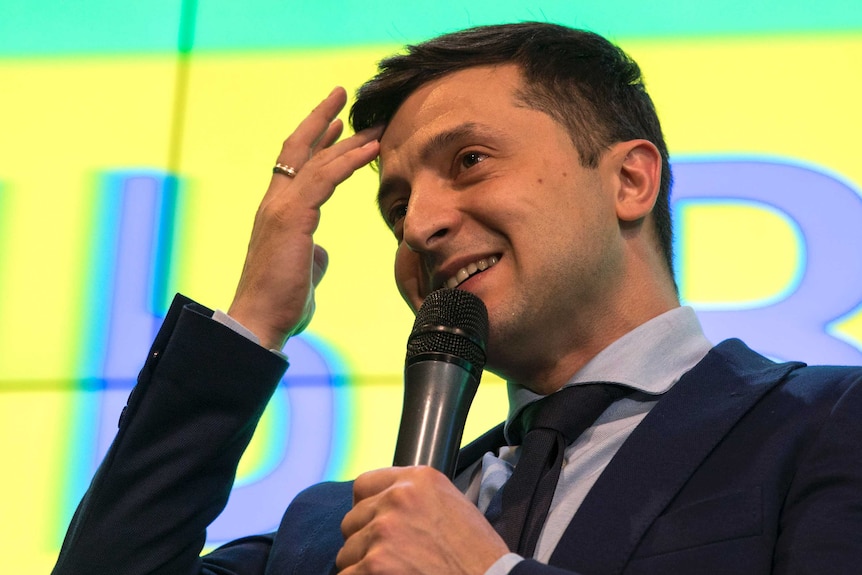 Ukrainian comedian Volodymyr Zelenskiy, reacts as he responds to a journalist question during a press conference.