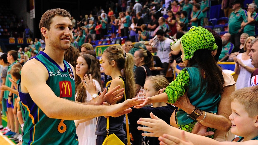 Crocodiles point guard Mitch Norton acknowledges the crowd after a Townsville win.