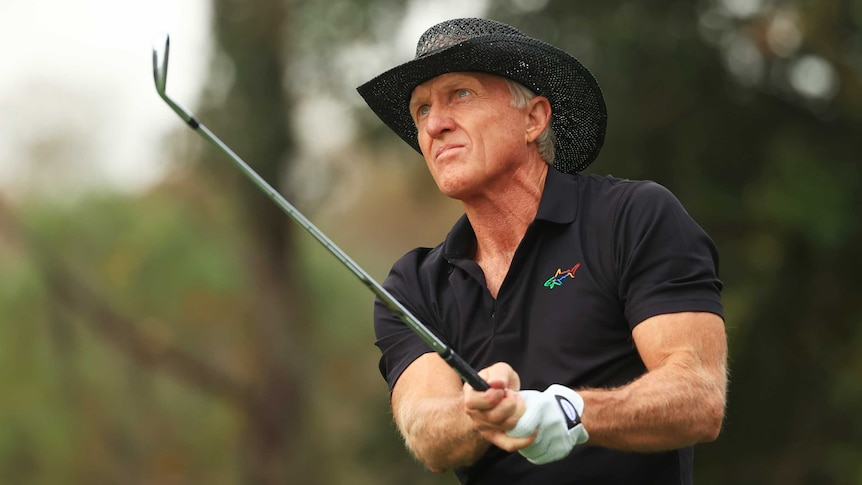 Greg Norman hitting a golf ball