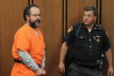 Ariel Castro (L), 53, enters the courtroom in Cleveland, Ohio July 26, 2013. Accused Cleveland kidna