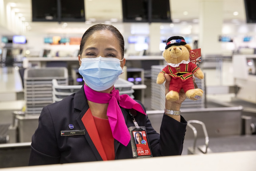 Airline staff in Sydney airport on the day Qantas restarted interntional flights in November.