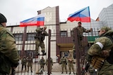 Pro-Russia milita hoist flags of Russia in Luhansk.