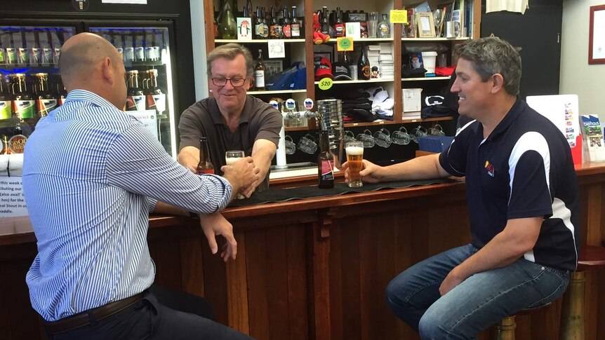 Ben Wigzell and Hayden Battle sit at a bar tasting lentil beer for the first time at Lobethal Bierhaus.