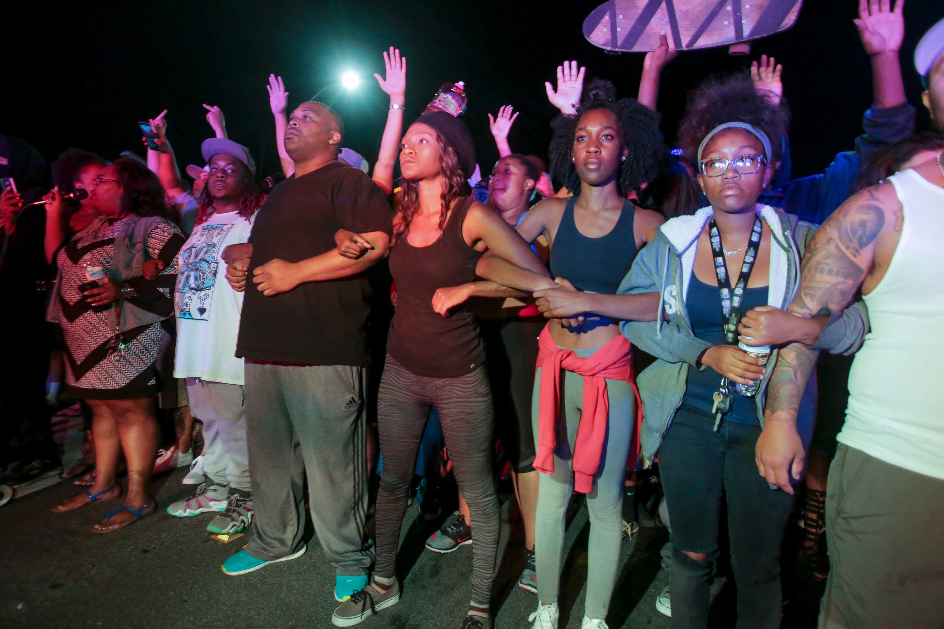 Protests grow tense after fatal police shooting of black man in ...