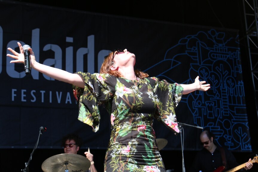 Singer Sarah Blasko performs on stage.