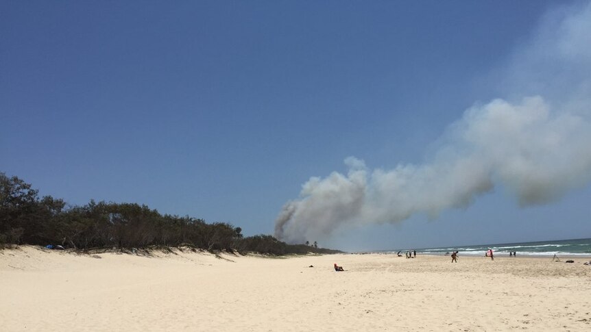 Thick smoke rises from the Southport Spit