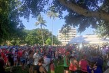 Hundreds of people gathered in a park as they warm up for the Rare Diseases Day fundraising fun run.