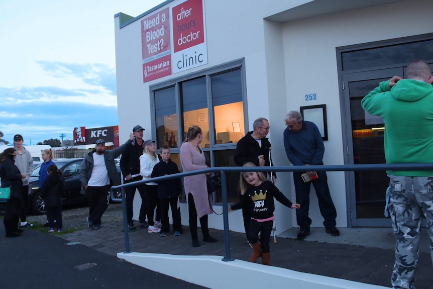 People queue outside Moonah GP