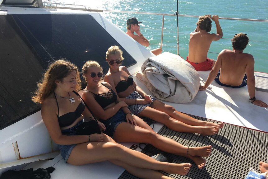 Tourists on a boat headed to the Whitsunday Islands after Cyclone Debbie