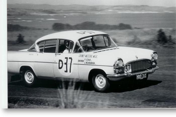 A black and white photo of a light blue Vauxhall Cresta during the 1960 Armstrong 500.