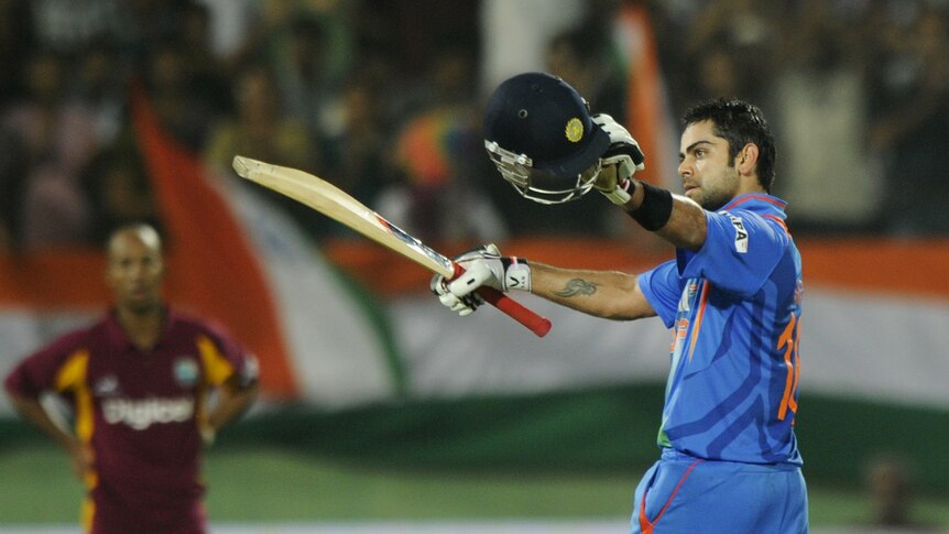 India's Virat Kohli upstaged Ravi Rampaul's earlier heroics with a match-winning century.