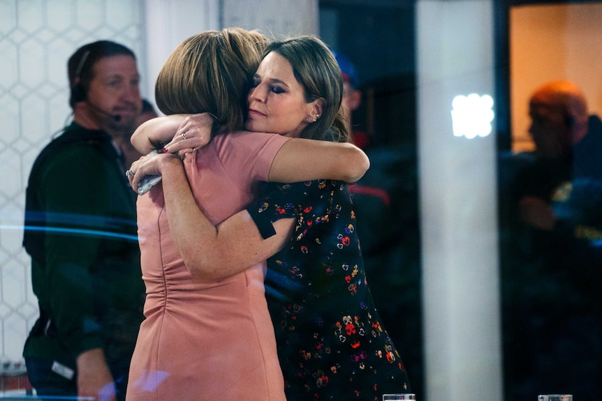 Hoda Kotb, left, and Savannah Guthrie embrace on the set of the "Today" show.