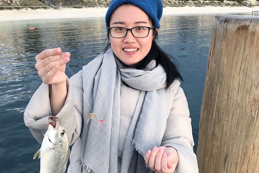 Woman holding fish