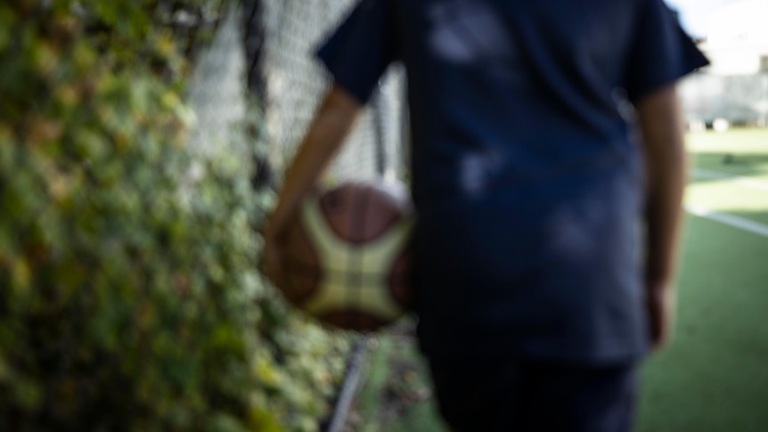 Boy holding basketball