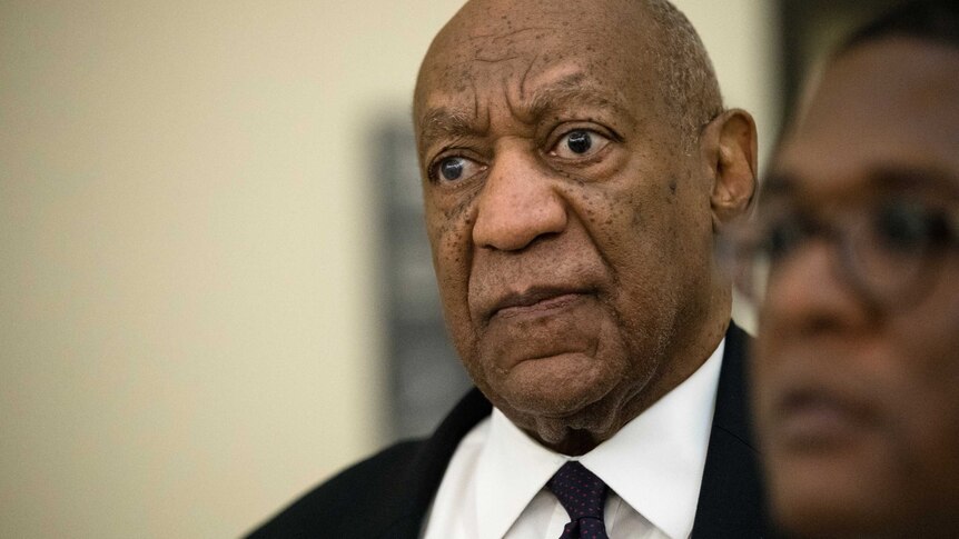 Bill Cosby returns to the courtroom during a break on the second day of his sexual assault trial.