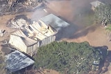 Aerial footage showed extensive fire damage to a shed in the vicinity of the Lowood blaze.