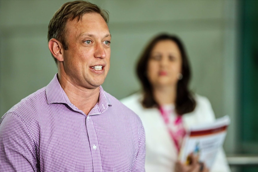 Steven Miles speaking and Annastacia Palaszczuk watching