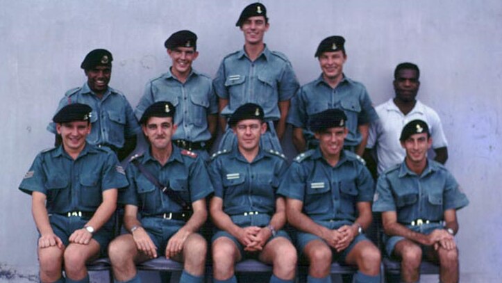 Doc Neeson (top row, centre)  in PNG where he was an army teacher