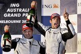 Debut top two: Jenson Button and Rubens Barrichello kick off the celebrations for Brawn GP.