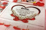 The notice says 'Kenny, Your absence has left a hole in my heart as deep as my budget black hole. I miss you, Michael'.