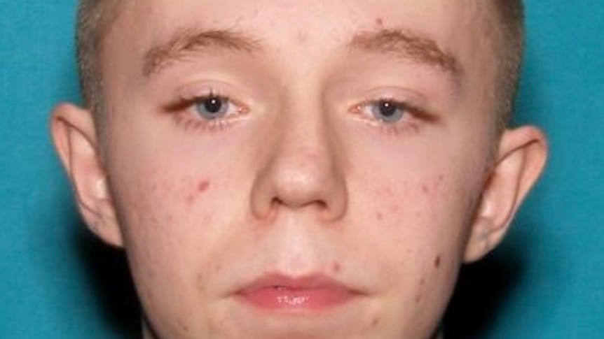 a close up image of the face of a young white man