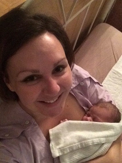 Tegan Taylor holding her newborn baby girl.