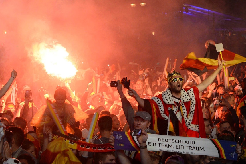 Fans of Germany at a public screening of the match in Berlin celebrate their team's win.